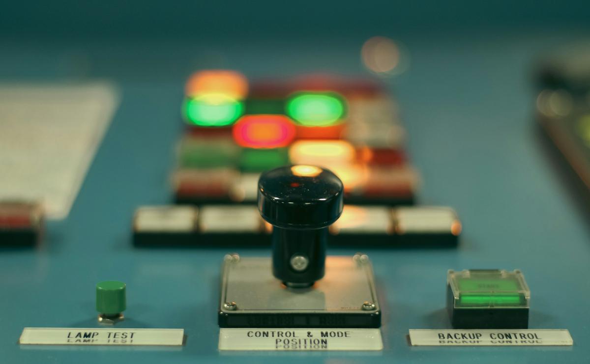 Illuminated control panel buttons in a ship’s control room